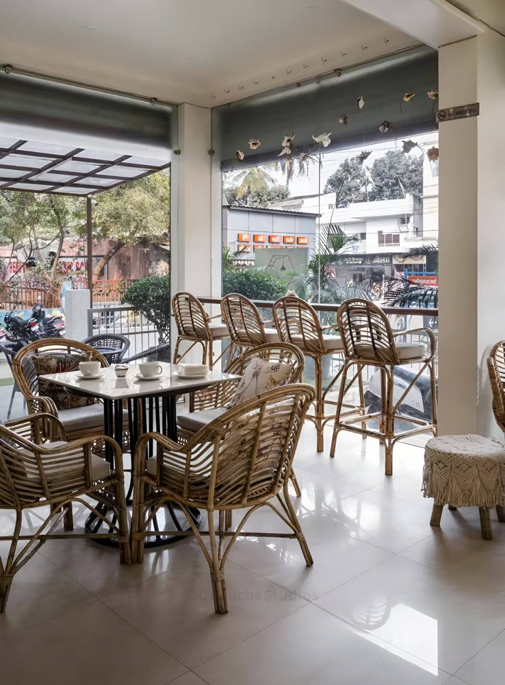 Lamington cafe seating with cane chairs and plants